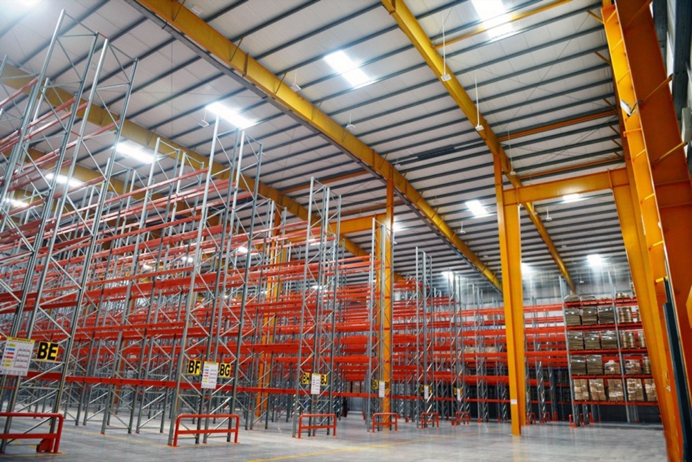 Connect Logistics cold storage warehouse exterior in Karachi — PIR-clad walls, loading dock canopy, dock equipment in red brand colour