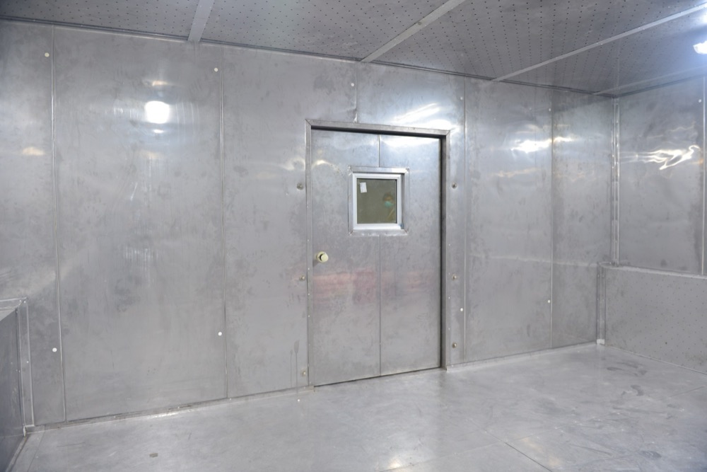 Test chamber inspection door at Haier Lahore facility with double-pane viewing window and gasket sealing