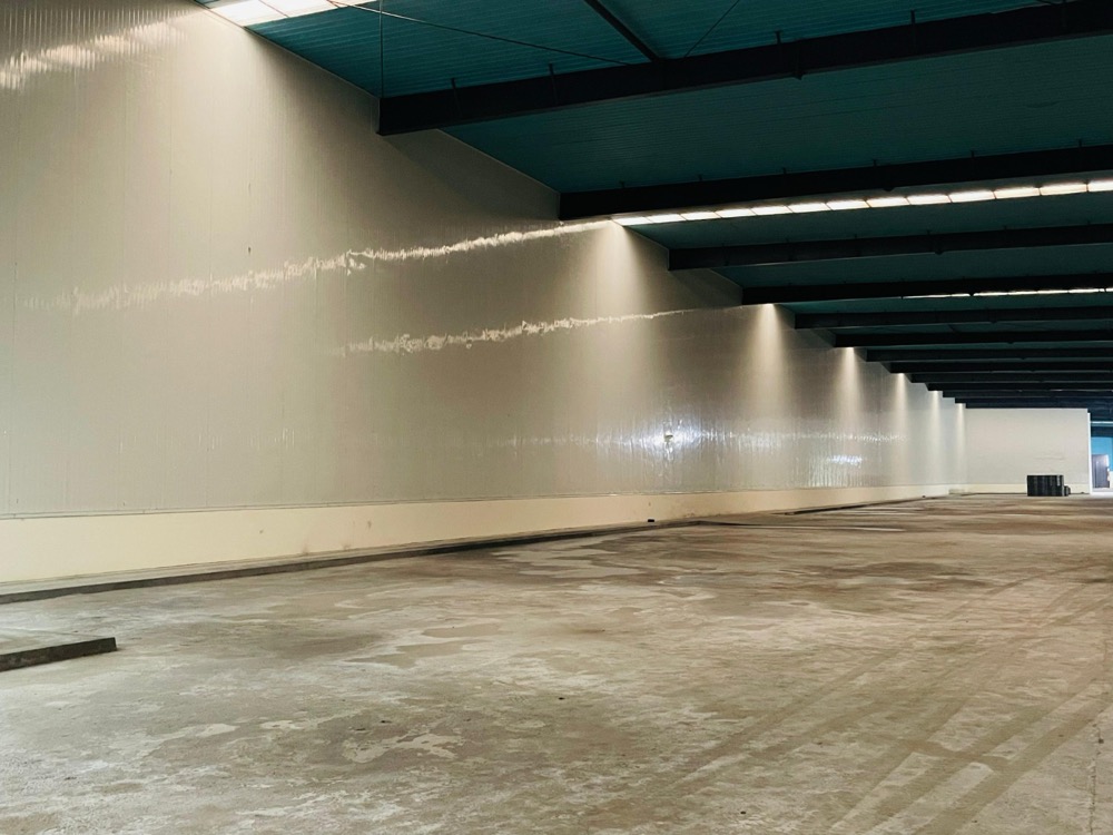 Cold-storage warehouse interior at Naubahar Bottling Pepsi Gujranwala with PIR sandwich panel walls under industrial lighting