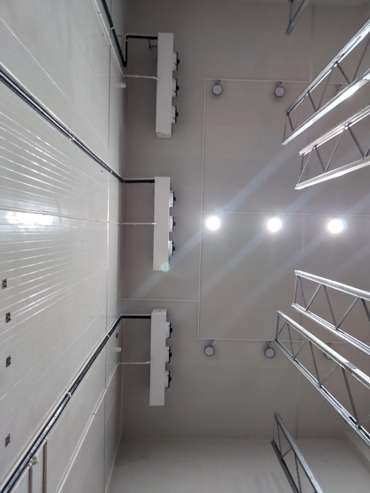 Cold storage interior view at TCCEC Lahore — high-bay racking under PIR-clad ceiling with refrigeration ductwork