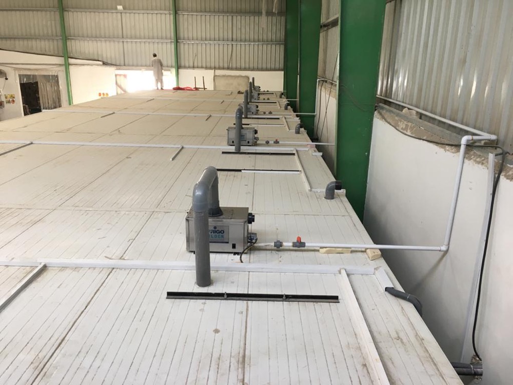 Banana ripening room evaporator detail — dual-fan ceiling-mounted unit at the USAID Sindh cold-chain facility